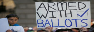 Sign reads Armed with Ballots