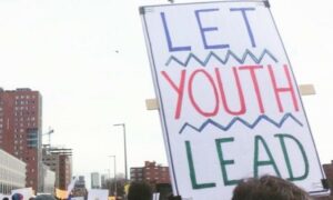 A protest sign that says "Let Youth Lead"