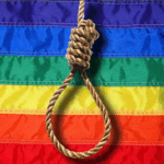 A noose with a pride flag backdrop.